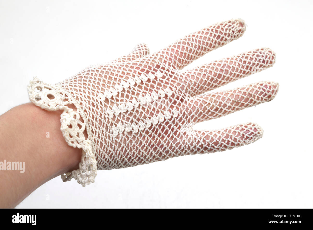 Handmade Knitted Lace Glove on hand Stock Photo