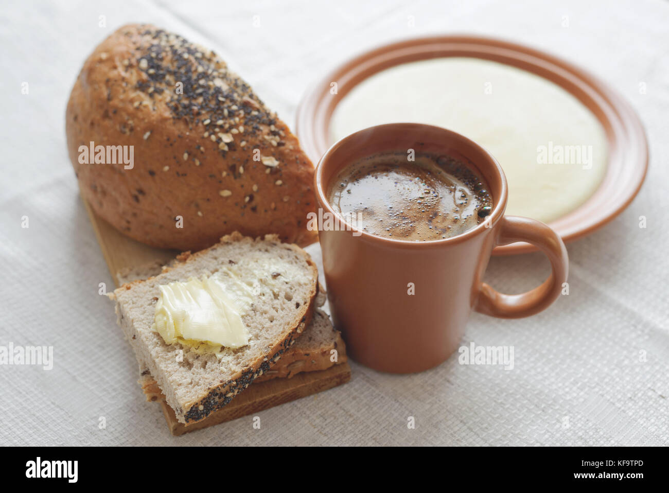 Breakfast-bread, butter, coffee and corn porridge Stock Photo