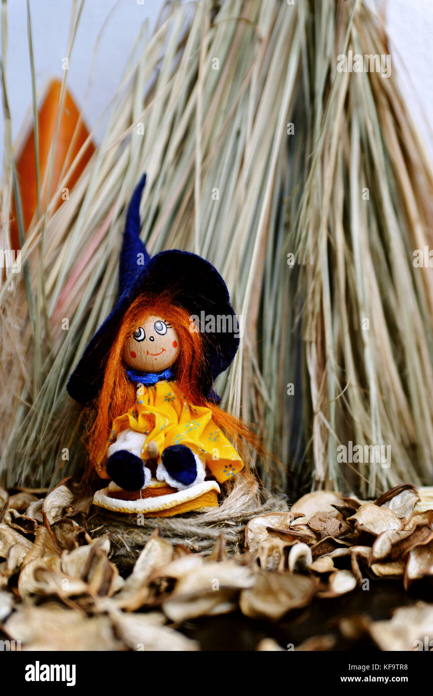 Puppet witch and her hut made of dry grass Stock Photo Alamy