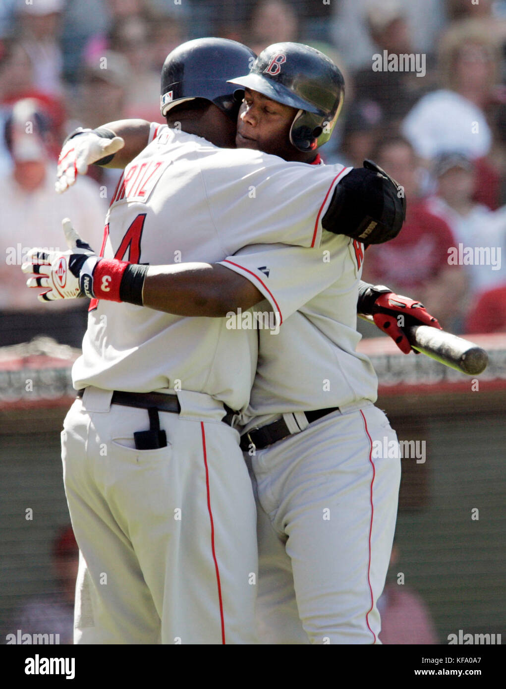 Boston Red Sox' Edgar Renteria, left, is greeted by teammate Manny