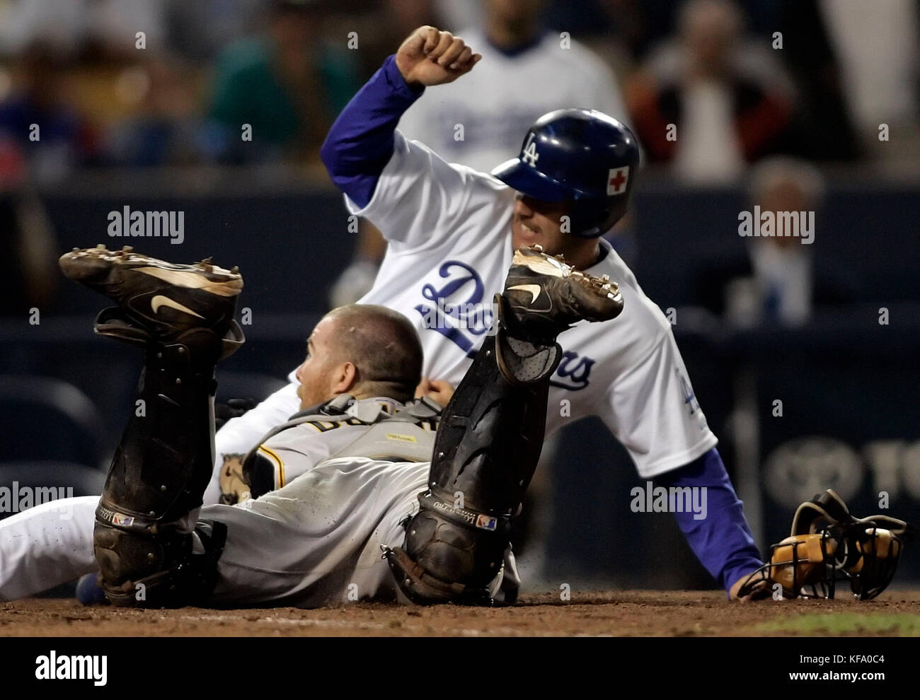 Los Angeles Dodgers' Jeff Kent, right, slides into home scoring past