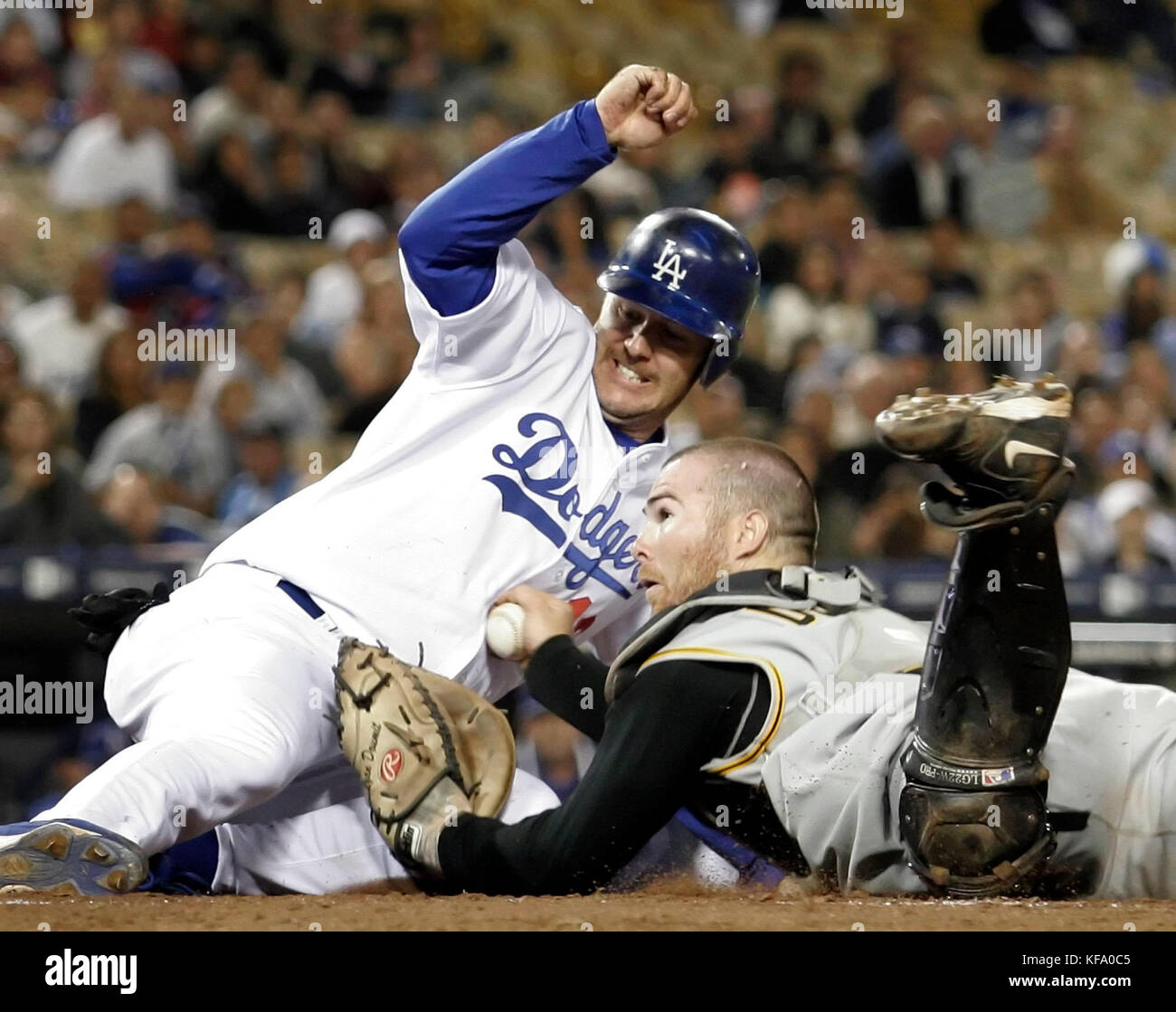 Los Angeles Dodgers' Jeff Kent, left, slides into home scoring past