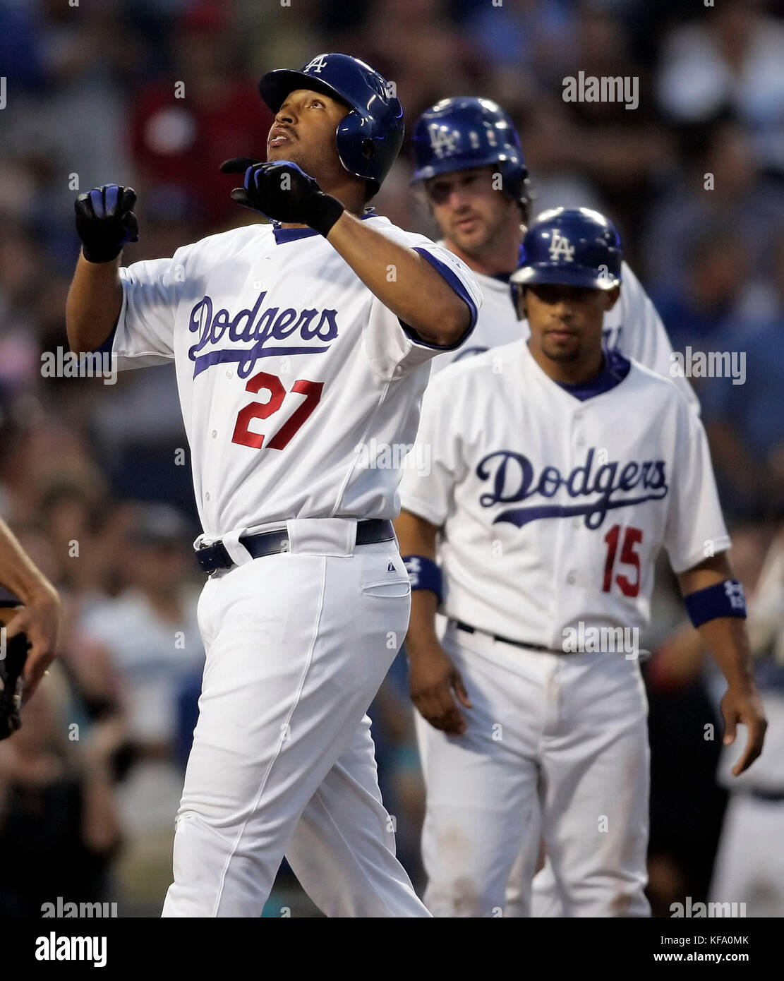 Los Angeles Dodgers' Matt Kemp, left, looks skyward while crossing home after hitting a three-run homer off Philadelphia Phillies pitcher Gavin Floyd that drove in Rafael Furcal (15) and Derek Lowe, background, in the second inning of a baseball game in Los Angeles on Thursday, June 1, 2006. Photo by Francis Specker Stock Photo