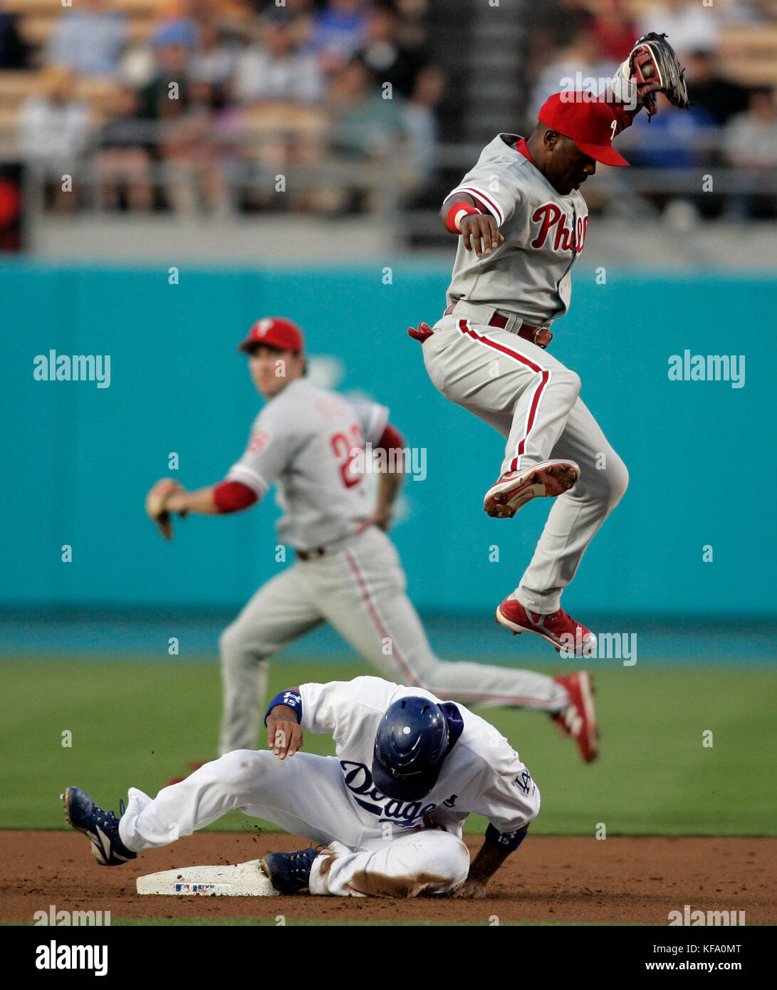 Philadelphia Phillies shortstop Jimmy Rollins (L) tags out Colorado Rockies  center fielder Dexter Fowler at second base during the first inning of game  four of the National League Divisional Series at Coors