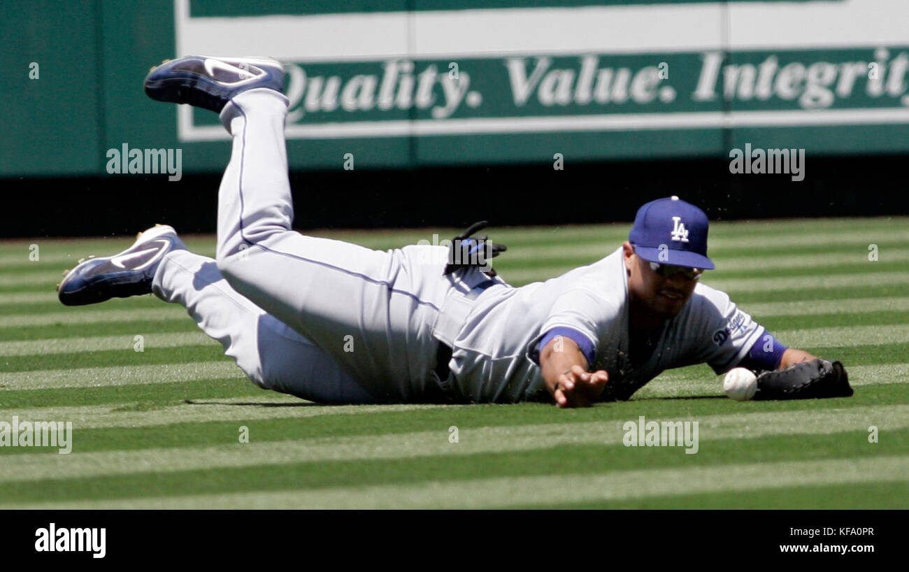 Los Angeles Dodgers center fielder Matt Kemp makes a diving attempt to field a fly ball hit by Los Angeles Angels' Vladimir Guerrero that scored Maicer Itzuris in the third inning  of a baseball game in Anaheim, Calif. on Saturday, July 1, 2006.  Photo by Francis Specker Stock Photo