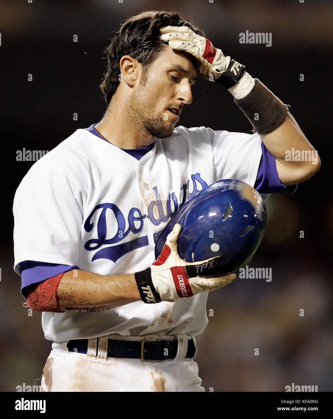 Los Angeles Dodgers' Nomar Garciaparra holds his head after getting hit in  the helmet by a pitch by Arizona Diamondbacks' Edgar Gonzalez in the fourth  inning of a baseball game in Los