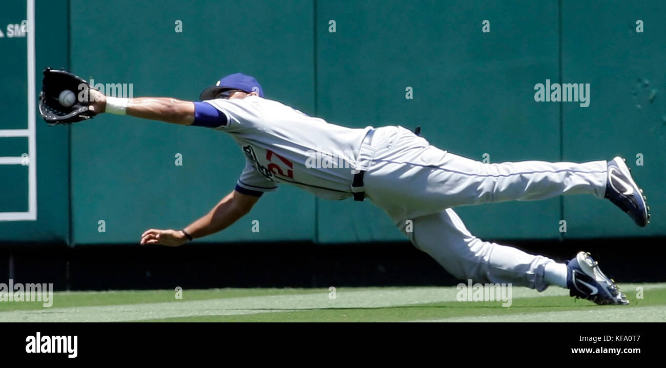 Los Angeles Dodgers' Matt Kemp tries to make a diving catch on a double hit by Los Angeles Angels' Garret Anderson in the second inning of an interleague baseball game in Anaheim, Calif., on Sunday, July 2, 2006. Kemp dropped the ball when he landed. Photo by Francis Specker Stock Photo