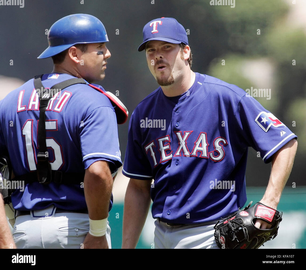 Texas Rangers pitcher Adam Eaton, right,  reacts with catcher Gerald Laird after his ejection from the game by home plate umpire Rob Drake in the first inning of a baseball game against the Los Angeles Angels in Anaheim, Calif., on Sunday, Aug. 6, 2006. Photo by Francis Specker Stock Photo