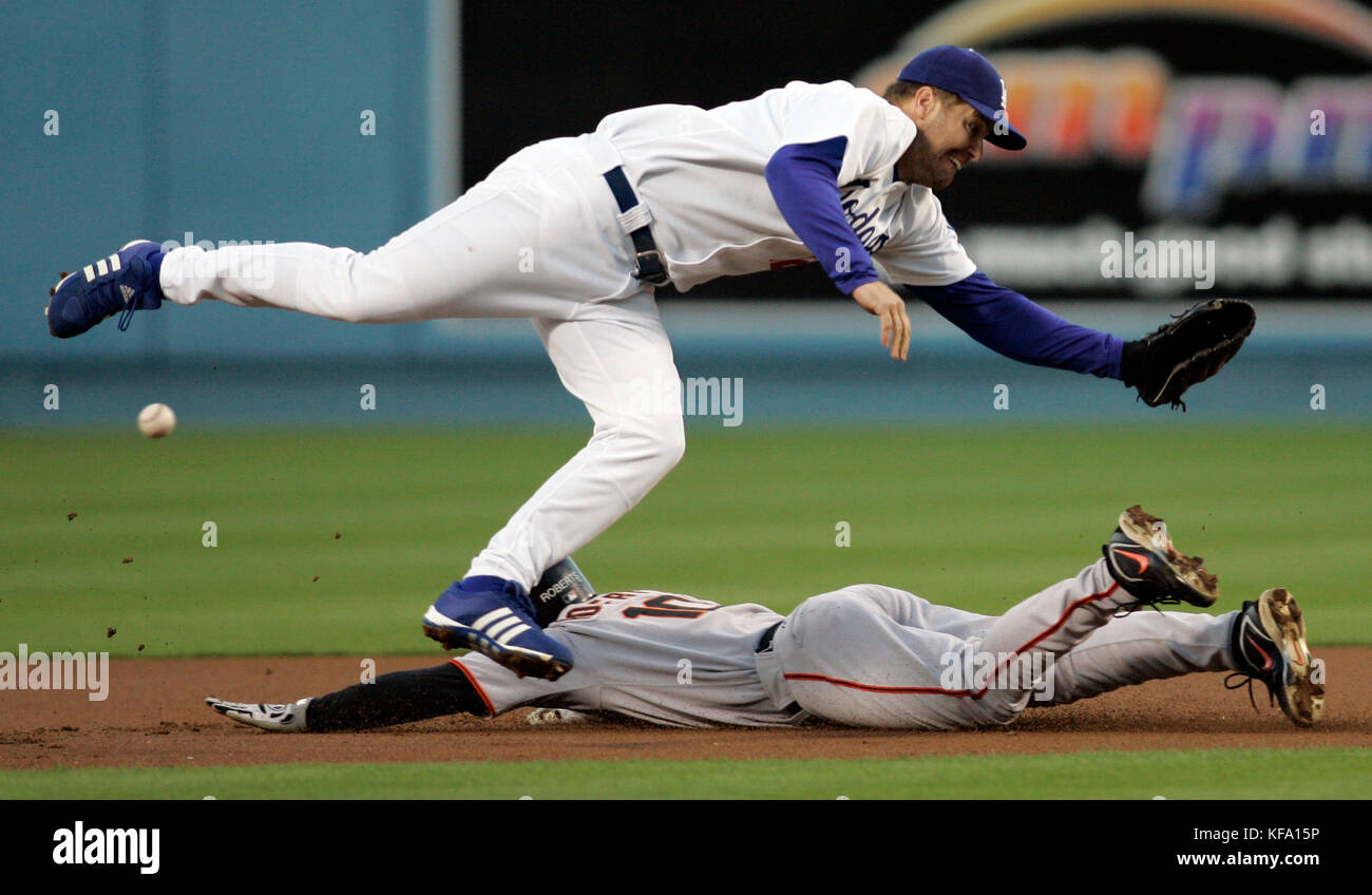 Los Angeles Dodgers second baseman Jeff Kent, top, tries to field an