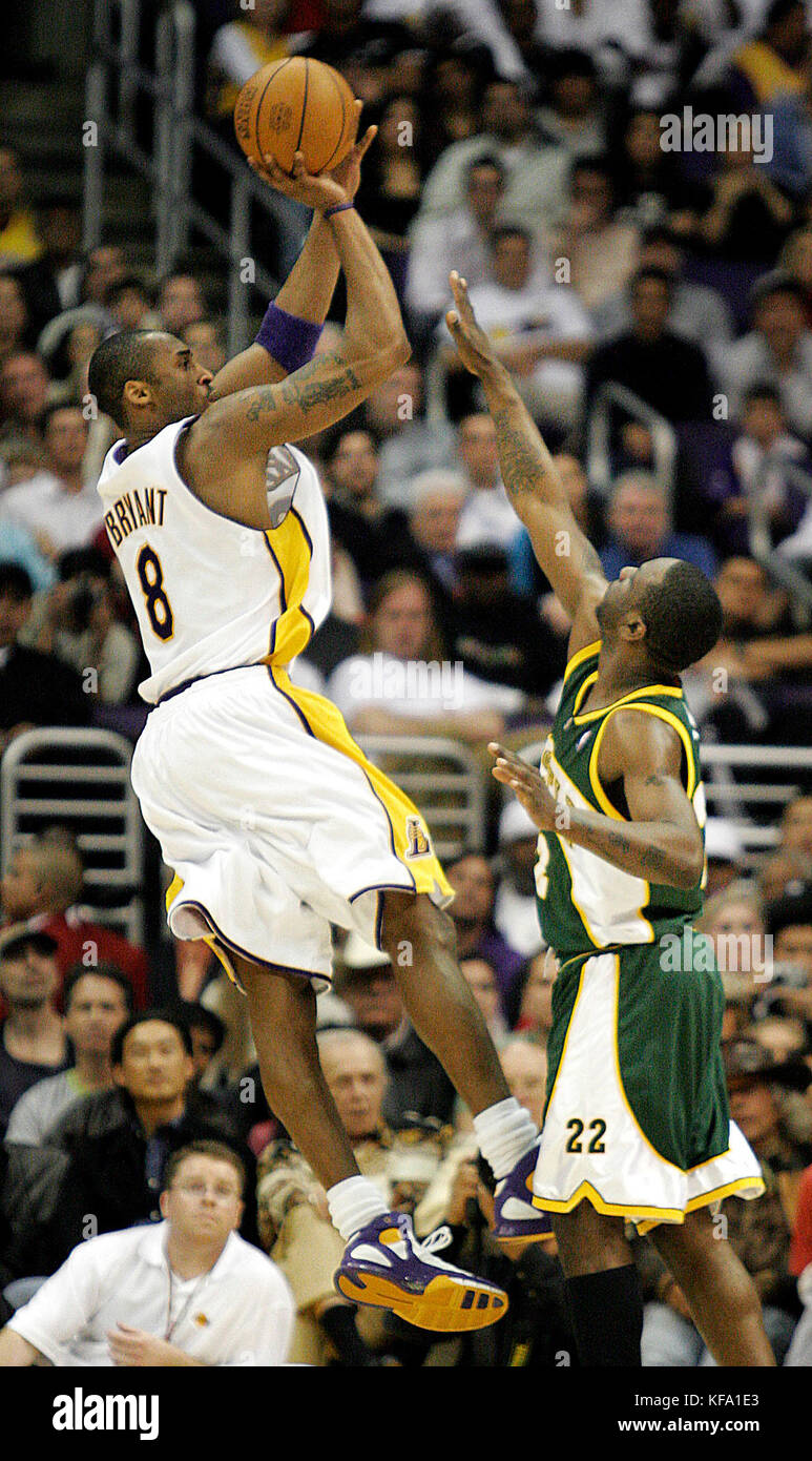 Los Angeles Lakers Kobe Bryant, left, shoots over Seattle Supersonics Ronald Murray in the fourth quarter in Los Angeles on Sunday, March 20, 2005.  Photo by Francis Specker Stock Photo