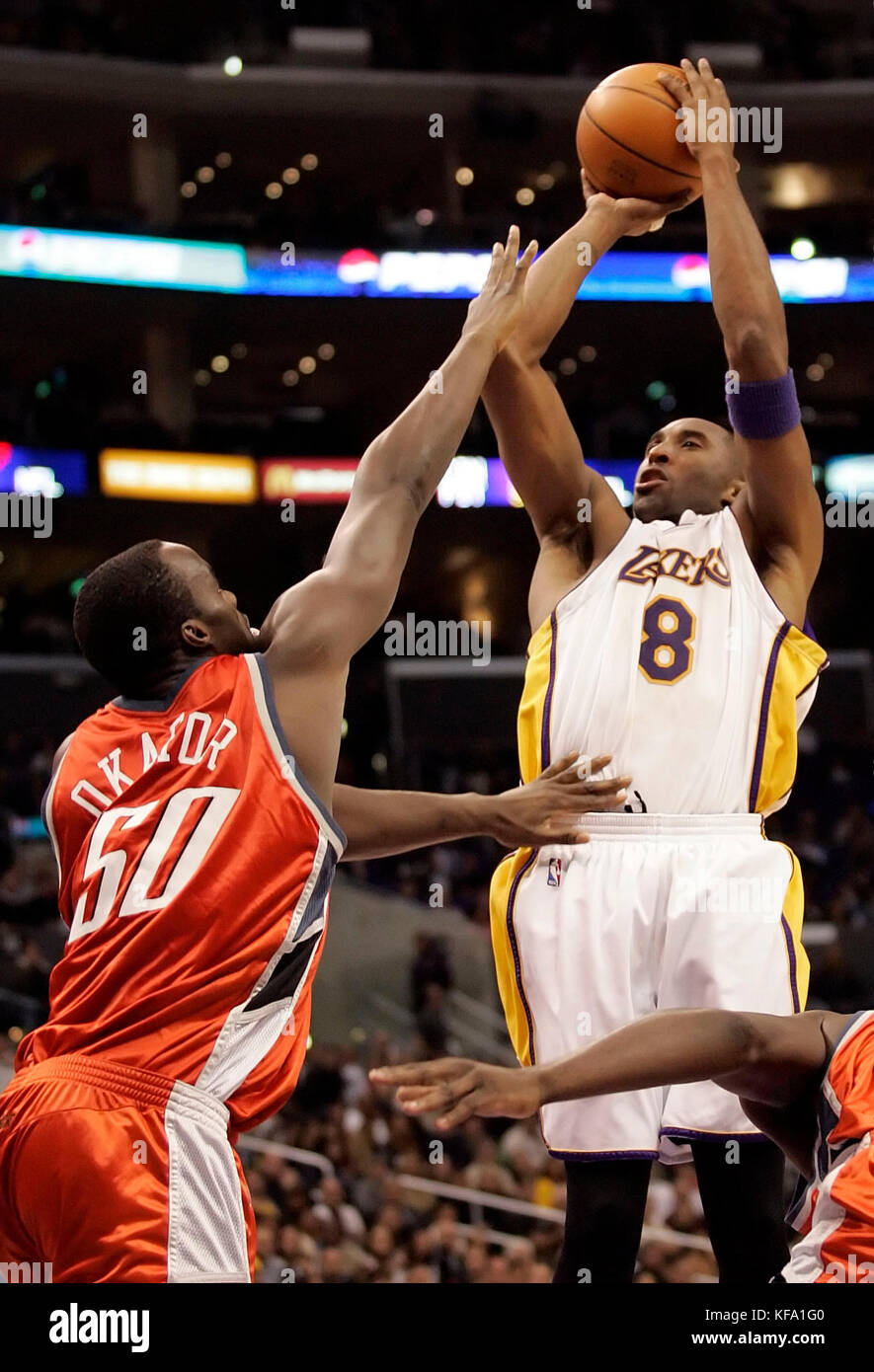 Los Angeles Lakers' Kobe Bryant (8) shoots over Charlotte Bobcats' Emeka Okafor in the fourth quarter in Los Angeles on Sunday Dec. 4, 2005. Photo by Francis Specker Stock Photo