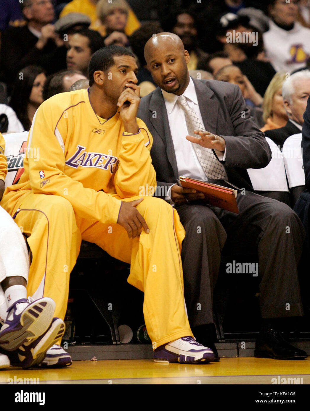 signee Jim Jackson, left, discuss plays 