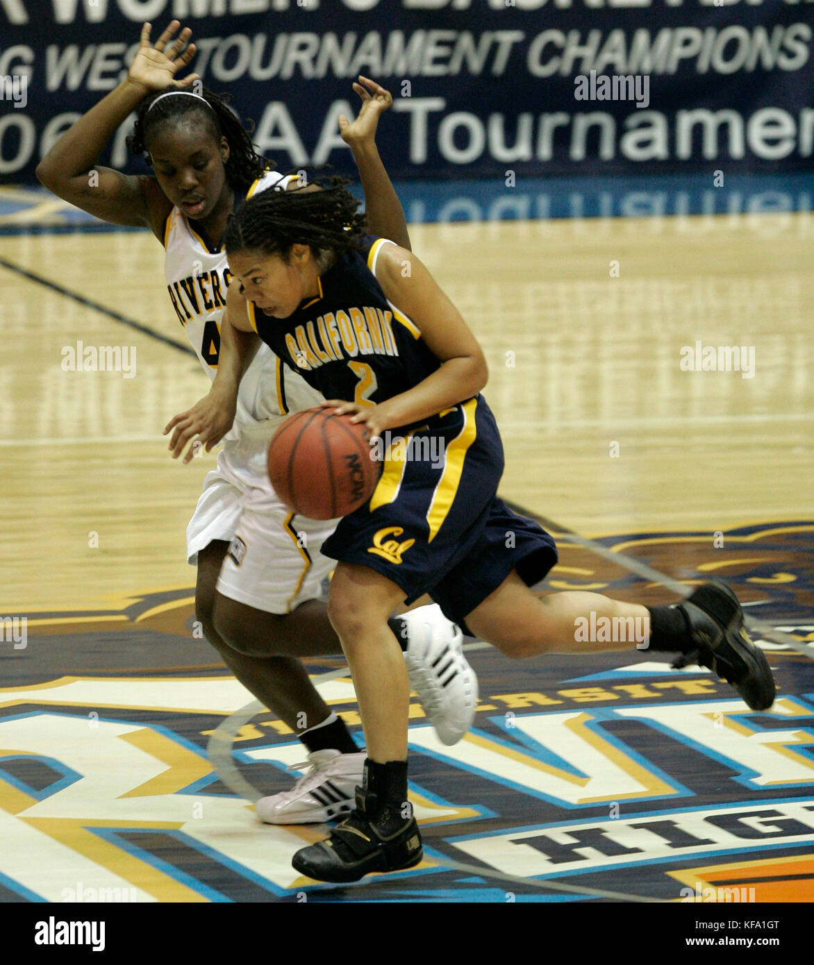 California's Natasha Vital, foreground, dribbles the ball upcourt ...