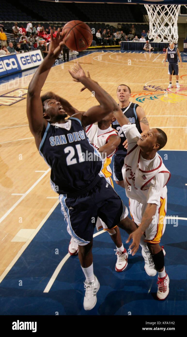 San Diego's Gyno Pomare (21) loses the handle of the ball while defended under the basket by Southern California's Davon Jefferson during the first half of a college basketball game in Anaheim, Calif., on Thursday, Nov. 22, 2007. Photo by Francis Specker Stock Photo