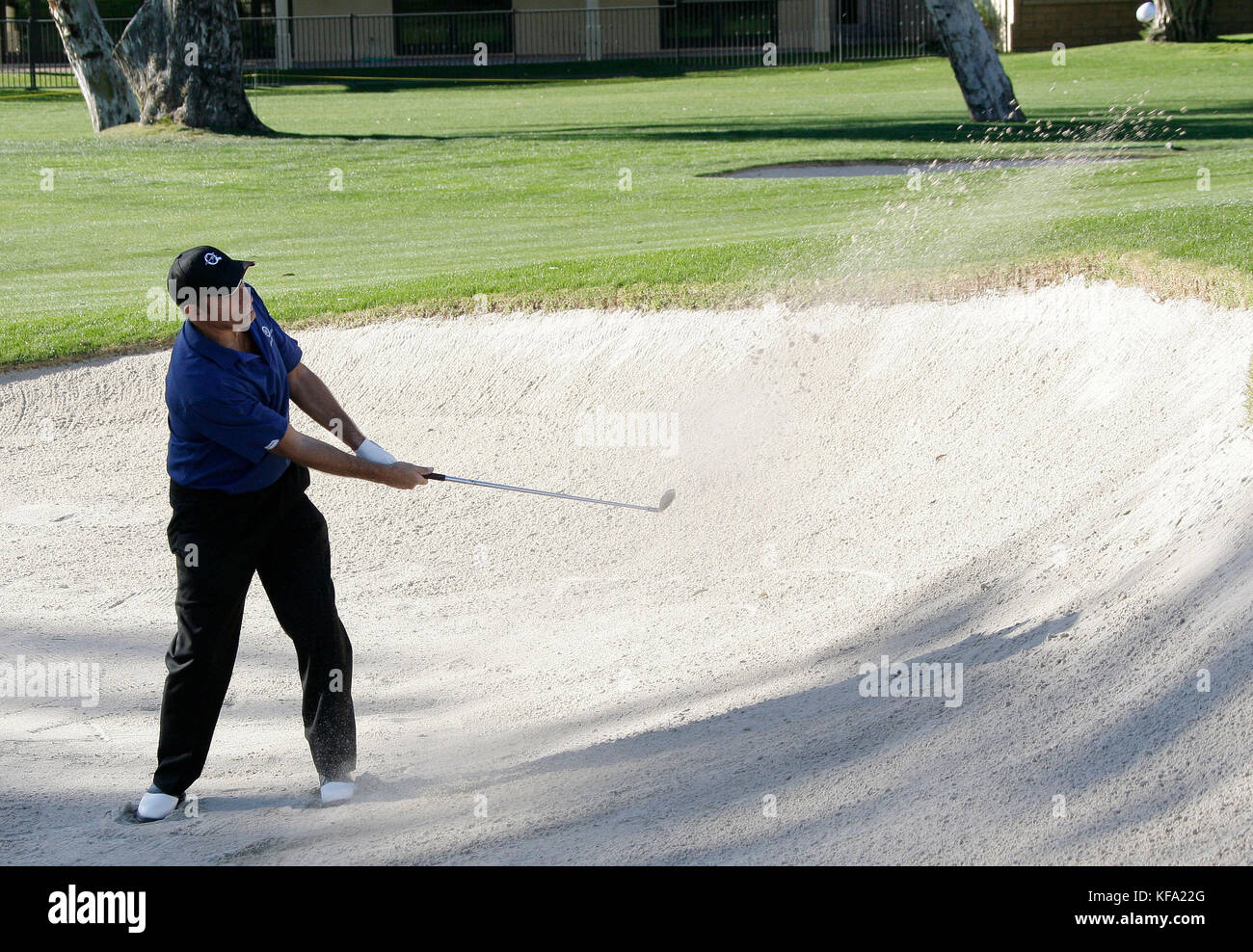 Singer Michael Bolton hits the ball out of a sand trap during a round of golf at the Bob Hope Chrysler Classic at the La Quinta Country Club in La Quinta, CA, on Thursday, Jan. 17, 2008. Photo credit: Francis Specker Stock Photo