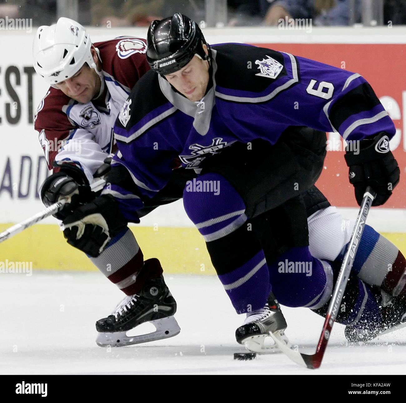 Los Angeles Kings' Bob Boughner, right, wards off Colorado Avalanche's Michael Cammalleri from the puck in the second period of an NHL hockey game in Los Angeles on Monday, March 20, 2006. Colorado won, 5-0. Photo by Francis Specker Stock Photo