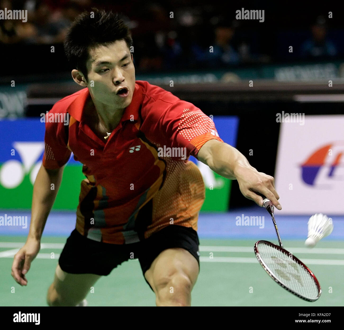 Dan Lin of China hits a backhand against Hyun Ii Lee of Korea during a quarterfinal match at the IBF Badminton World Championships in Anaheim, Calif. on Friday, Aug. 19, 2005.  Lin won, 5-15, 15-7, 15-8. Photo by Francis Specker Stock Photo