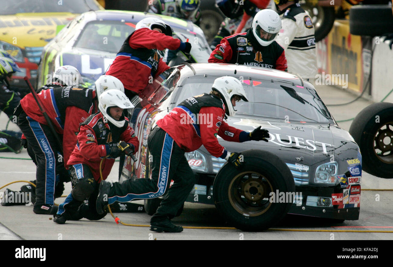 The pit crew for Carl Edwards' car changes tires during the Stater Bros. 300, a Busch series auto race, at the California Speedway in Fontana, Calif. on Saturday, Feb. 25, 2006. Edwards finished third. Photo by Francis Specker Stock Photo