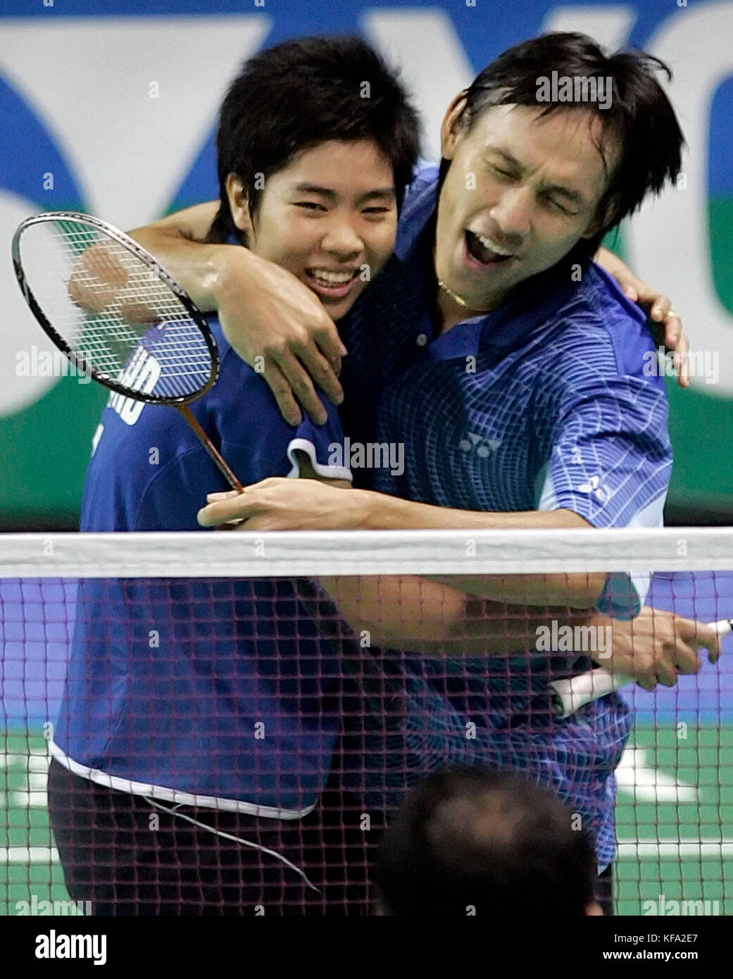 Sudket Prapakamol of Thailand, right, hugs compatriot Saralee