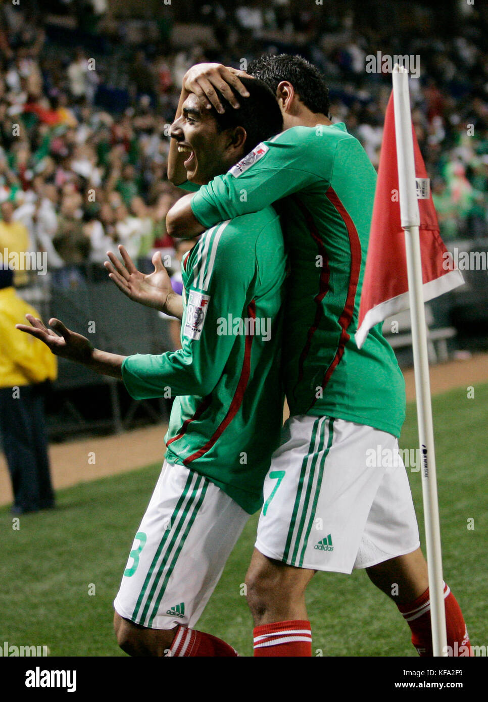 Mexico's Edgar Castillo, left, is hugged by teammate Pablo Barrera after scoring a goal against Guatemal in the first half at a CONCACAF Men's Olympic Qualifying soccer tournament game in Carson, Calif., on Friday, March 14, 2008. Photo by Francis Specker Stock Photo