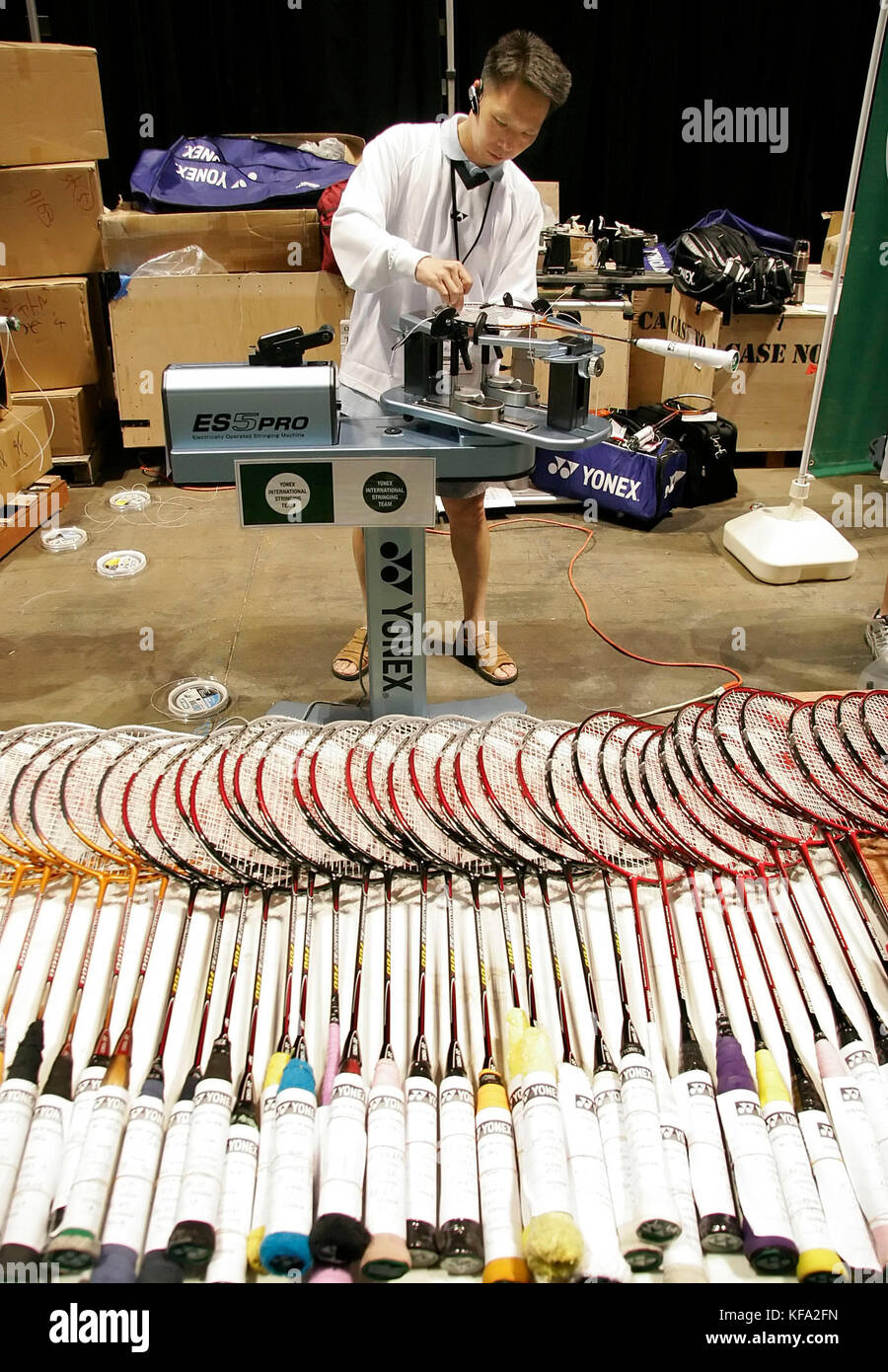 Paul Ng of Los Angeles strings a badminton racket at the IBF 2005