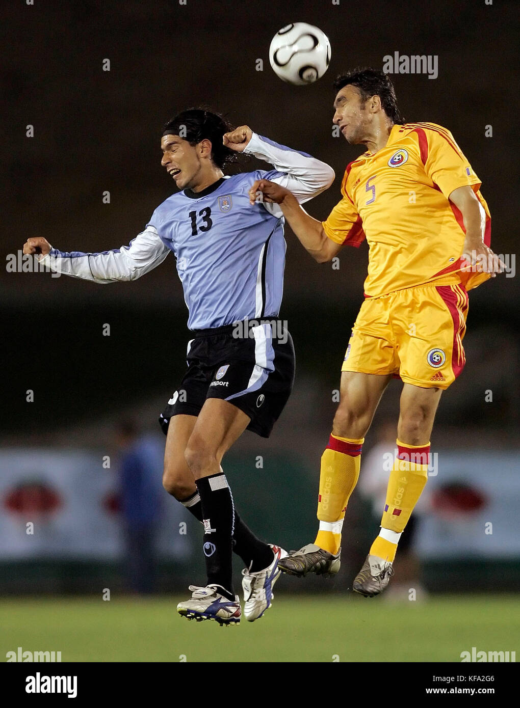 Romania's Adrian Yensci, right, heads the ball over Uruguay's Sebastian Abreu during the first half of a soccer match in Los Angeles on Tuesday, May 23, 2006. Photo by Francis Specker Stock Photo