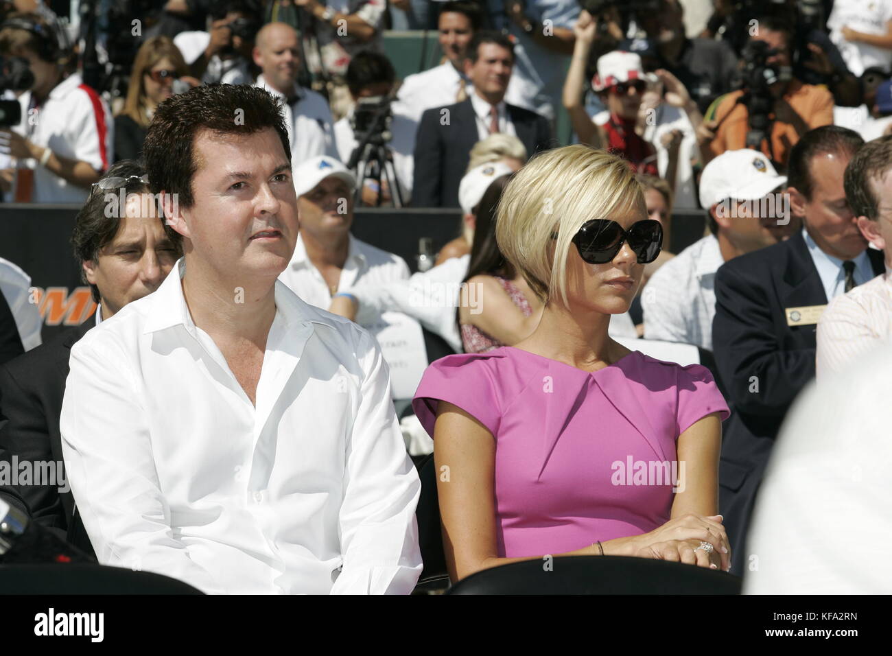 Victoria Beckham, wife of David Beckham, with Simon Fuller, left, at the official presentation of David Beckham to the Los Angeles Galaxy at the Home Depot Center in Carson, CA on July 13, 2007. Photo credit: Francis Specker Stock Photo