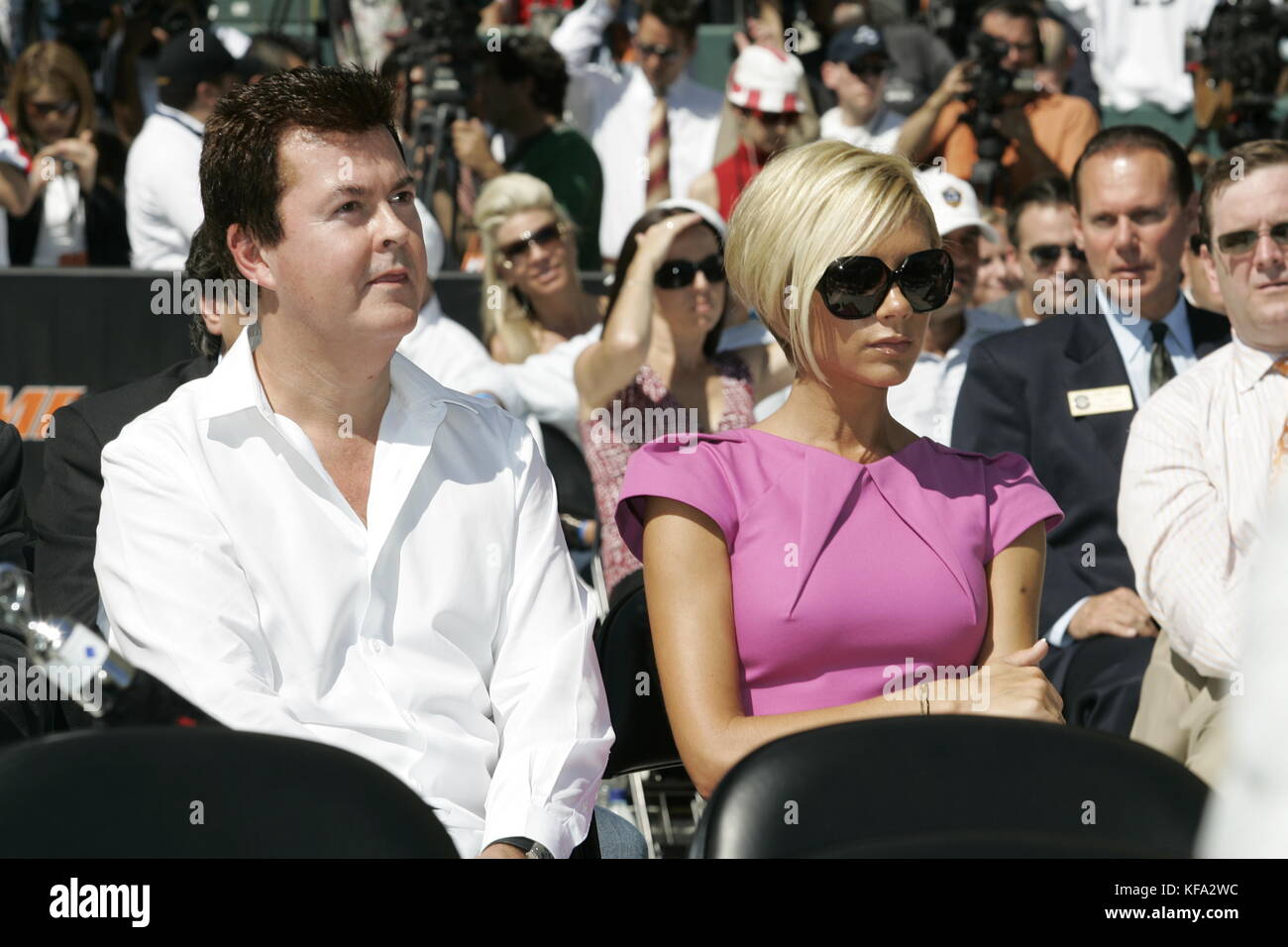 Victoria Beckham, wife of David Beckham, with Simon Fuller, left, at the official presentation of David Beckham to the Los Angeles Galaxy at the Home Depot Center in Carson, CA on July 13, 2007. Photo credit: Francis Specker Stock Photo