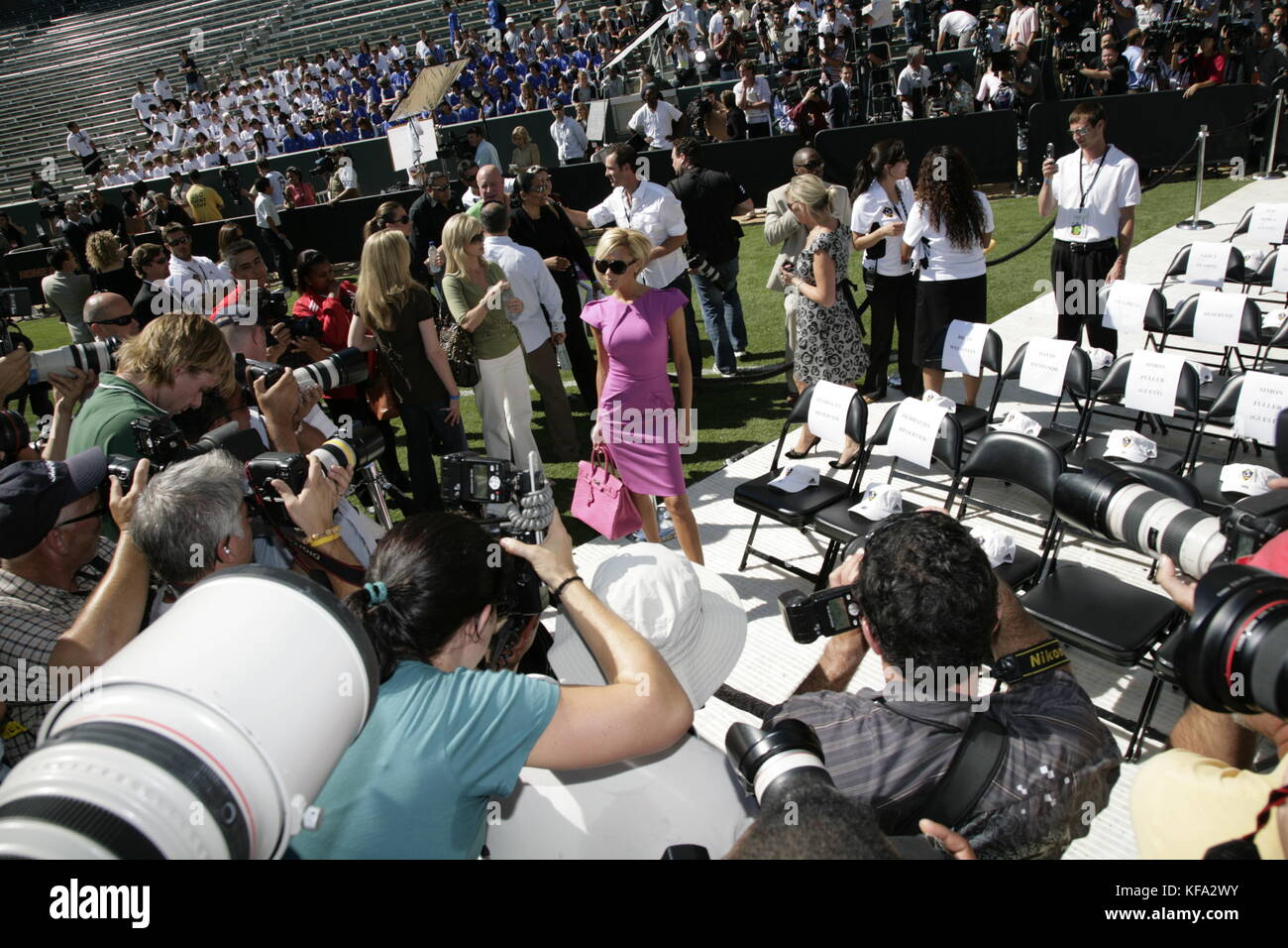 Victoria Beckham is mobbed by photographers at the official presentation of David Beckham to the Los Angeles Galaxy at the Home Depot Center in Carson, CA on July 13, 2007. Photo credit: Francis Specker Stock Photo