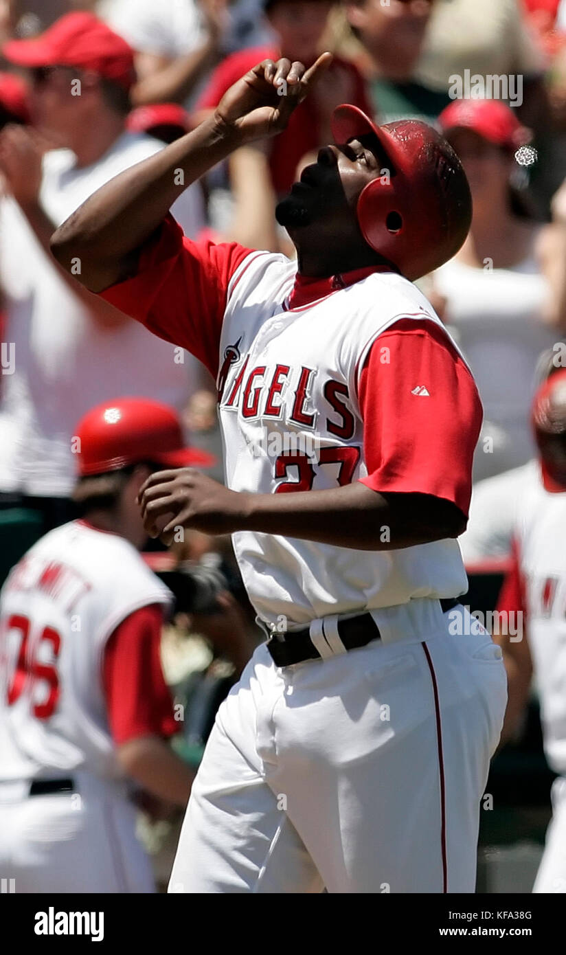 Los Angeles Angels' Vladimir Guerrero points skyward at home plate after hitting a three-run homer off Texas Rangers pitcher Josh Rupe in the second inning of a baseball game in Anaheim, Calif., on Sunday, Aug. 6, 2006. Photo by Francis Specker Stock Photo