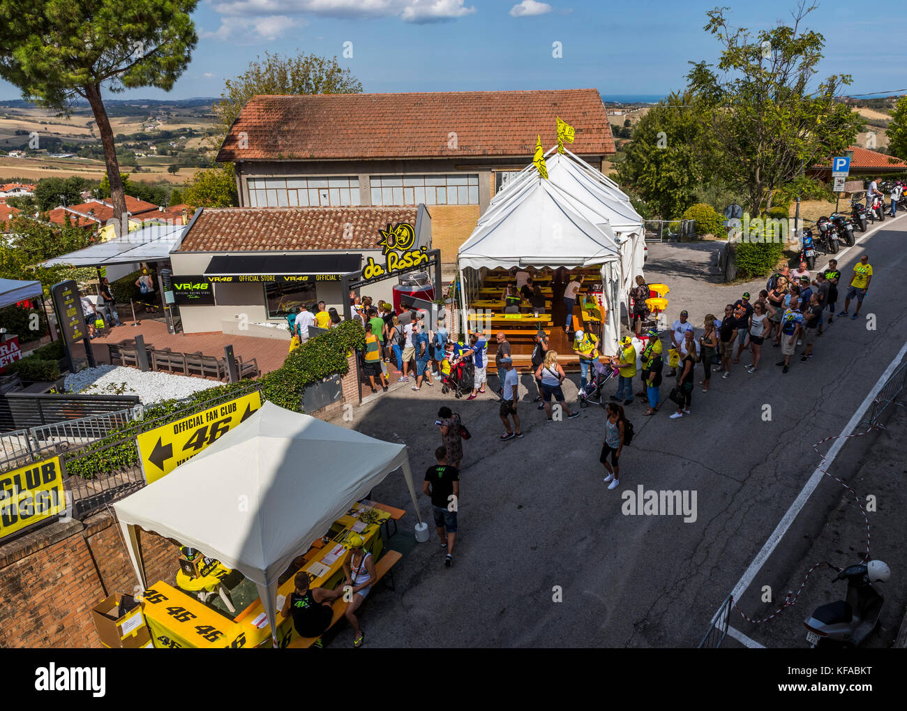 Fans queue at the VR46 merchandise and fan shop. Tavullia, Italy. Hometown  of Valentino Rossi Stock Photo - Alamy