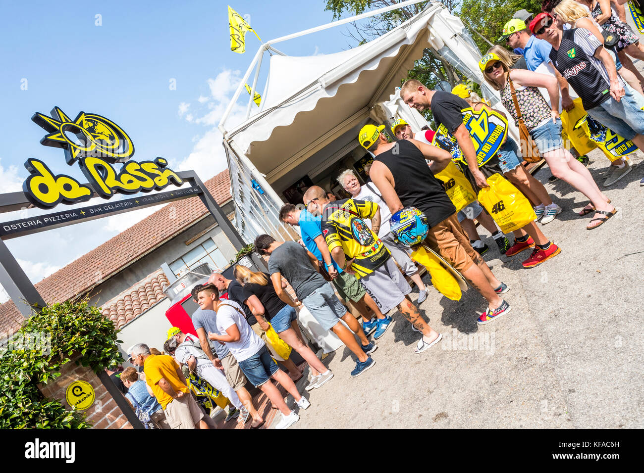 Fans queue at the VR46 merchandise and fan shop. Tavullia, Italy. Hometown  of Valentino Rossi Stock Photo - Alamy