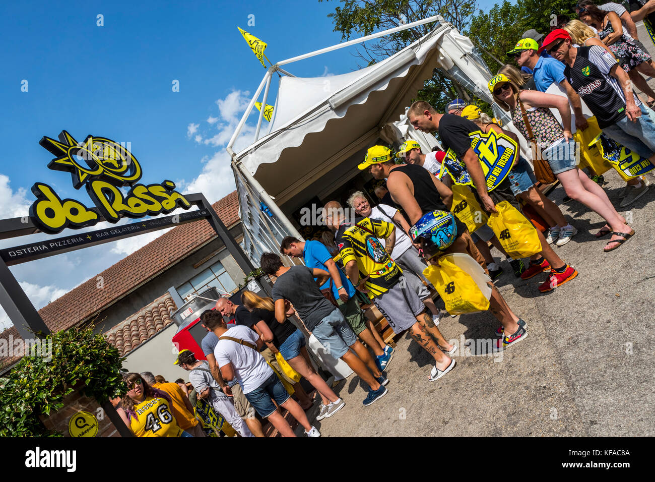 Fans queue at the VR46 merchandise and fan shop. Tavullia, Italy. Hometown  of Valentino Rossi Stock Photo - Alamy