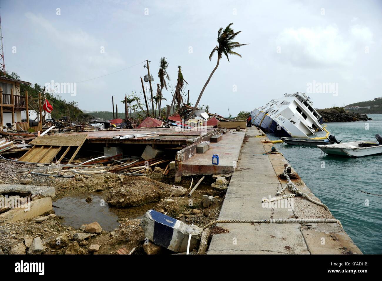 U.S. Coast Guard officers inspect a damaged and partially-sunk boat during relief efforts in the aftermath of Hurricane Irma October 18, 2017 in Crown Bay, St. Thomas, U.S. Virgin Islands.   (photo by Matthew S. Masaschi via Planetpix) Stock Photo