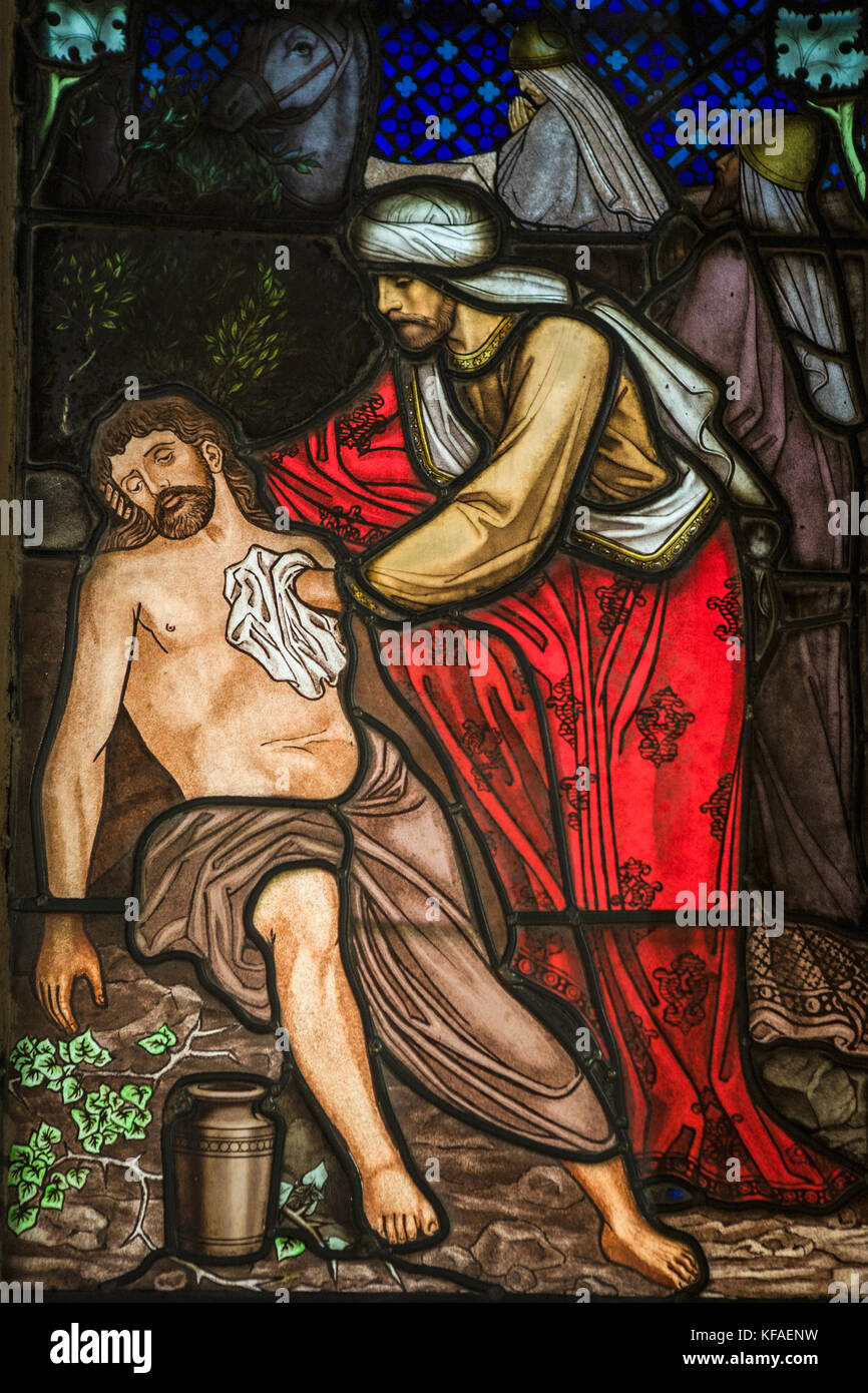 Stained glass window showing the Good Samaritan, Holy Trinity Church, Skipton, Yorkshire, England, UK Stock Photo