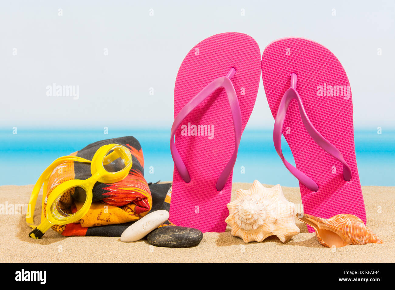 Flip flops on the beach Stock Photo - Alamy