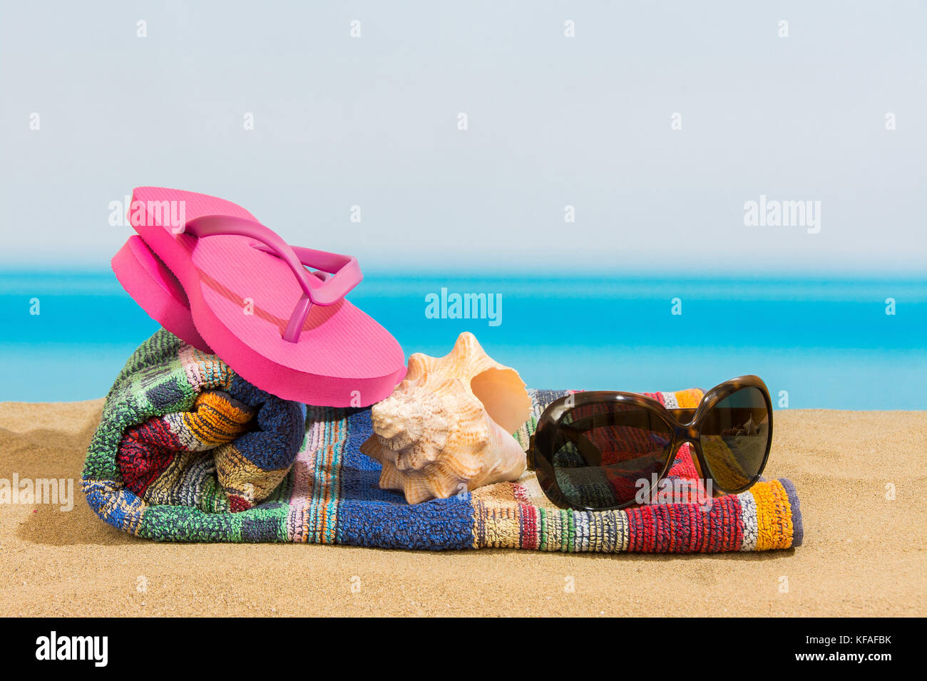 Flip flops on the beach Stock Photo - Alamy