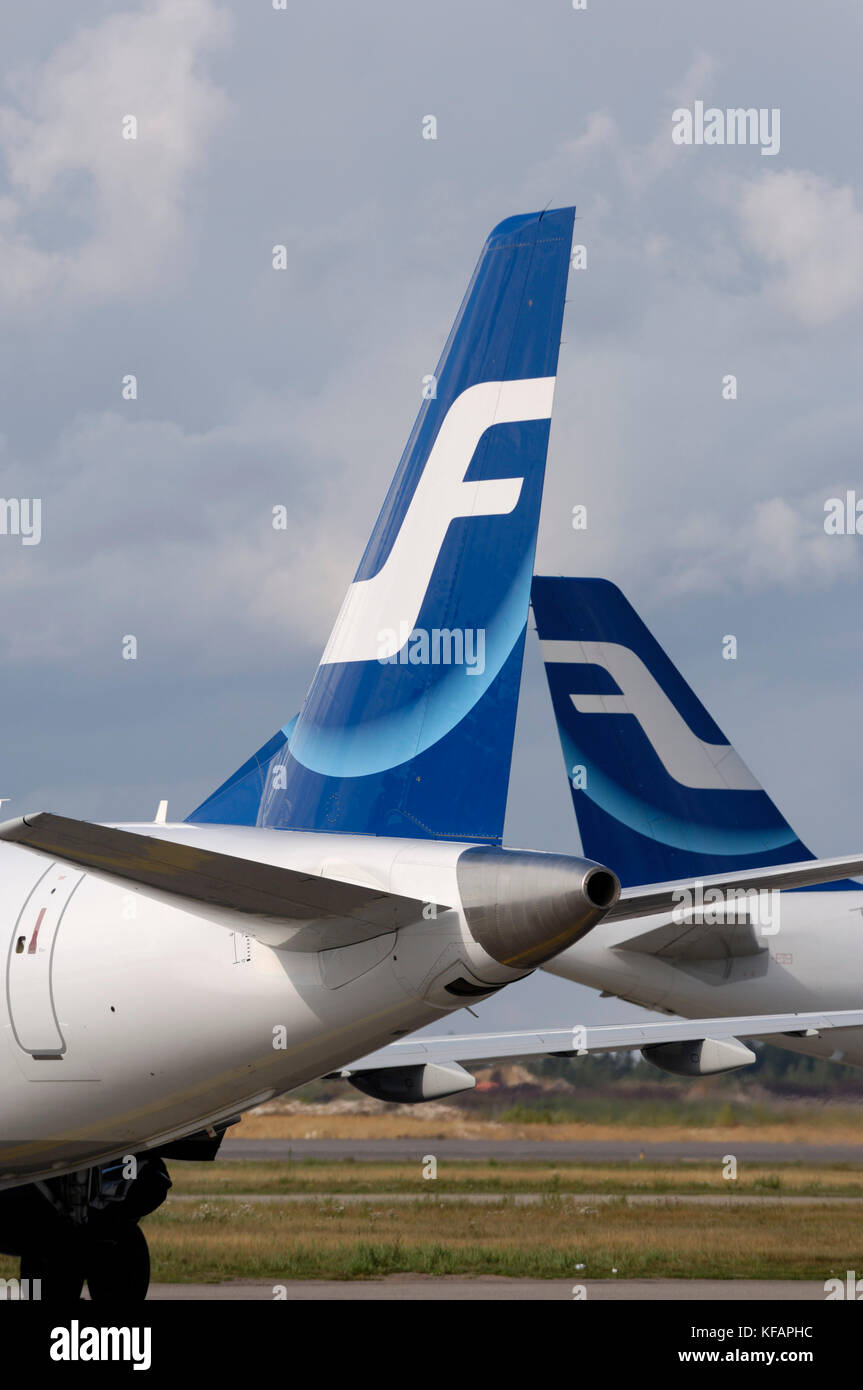 tail of two Finnair Embraer 170s Stock Photo