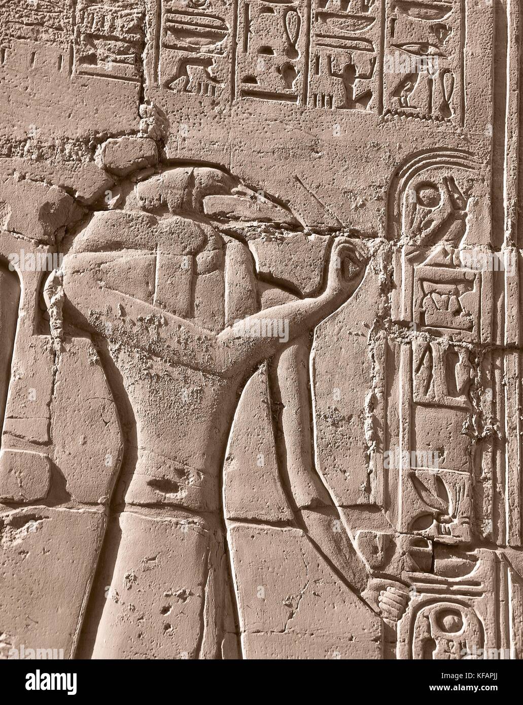 The God Thoth writing, detail from scenes of offerings to the gods, relief, interior walls of the Great Hypostyle Hall, Temple of Amun, Karnak temple complex (Unesco World Heritage List, 1979). Egyptian civilisation, New Kingdom, Dynasty XIX. Stock Photo