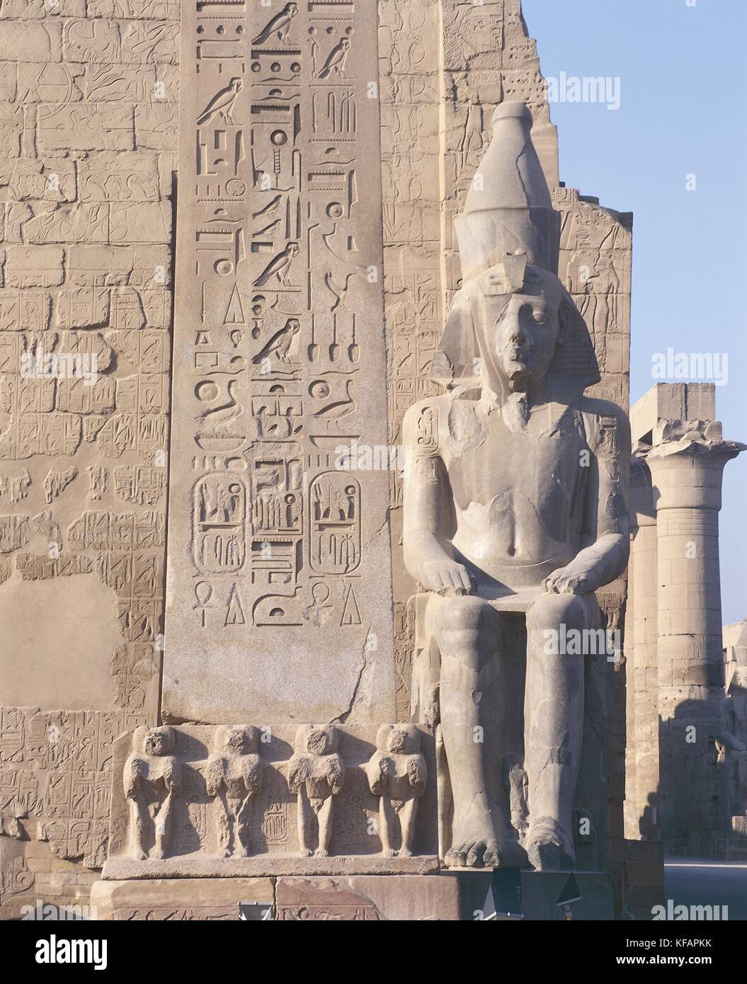 Egypt, Ancient Thebes (UNESCO World Heritage List, 1979). Luxor. Temple of Amon. Pylon of Ramses II, 1290-1224 BC. Colossal statue of Ramses II, 1290-1224 BC Stock Photo