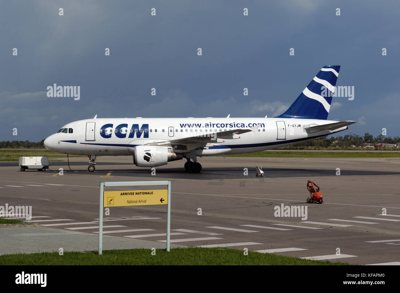 a national arrivals sign in the French and English languages with a CCM ...