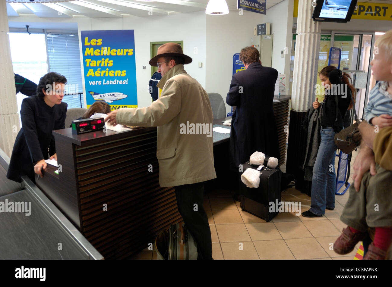 passengers with bags at the Ryanair checkin desk in the terminal Stock Photo Alamy