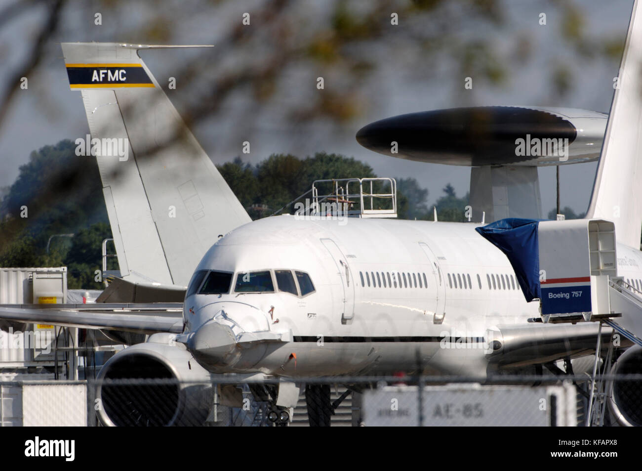 Boeing 757-200 Catfish with modified nose parked on the apron with USAF E-3B AWACS behind Stock Photo