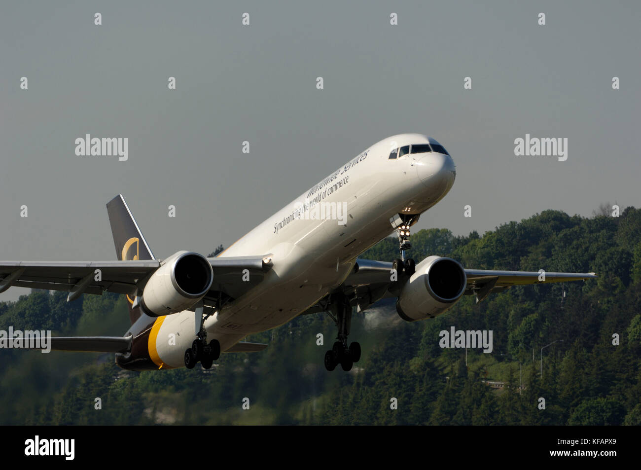 a UPS United Parcel Service Boeing 757-200 freighter climbing out after take-off Stock Photo