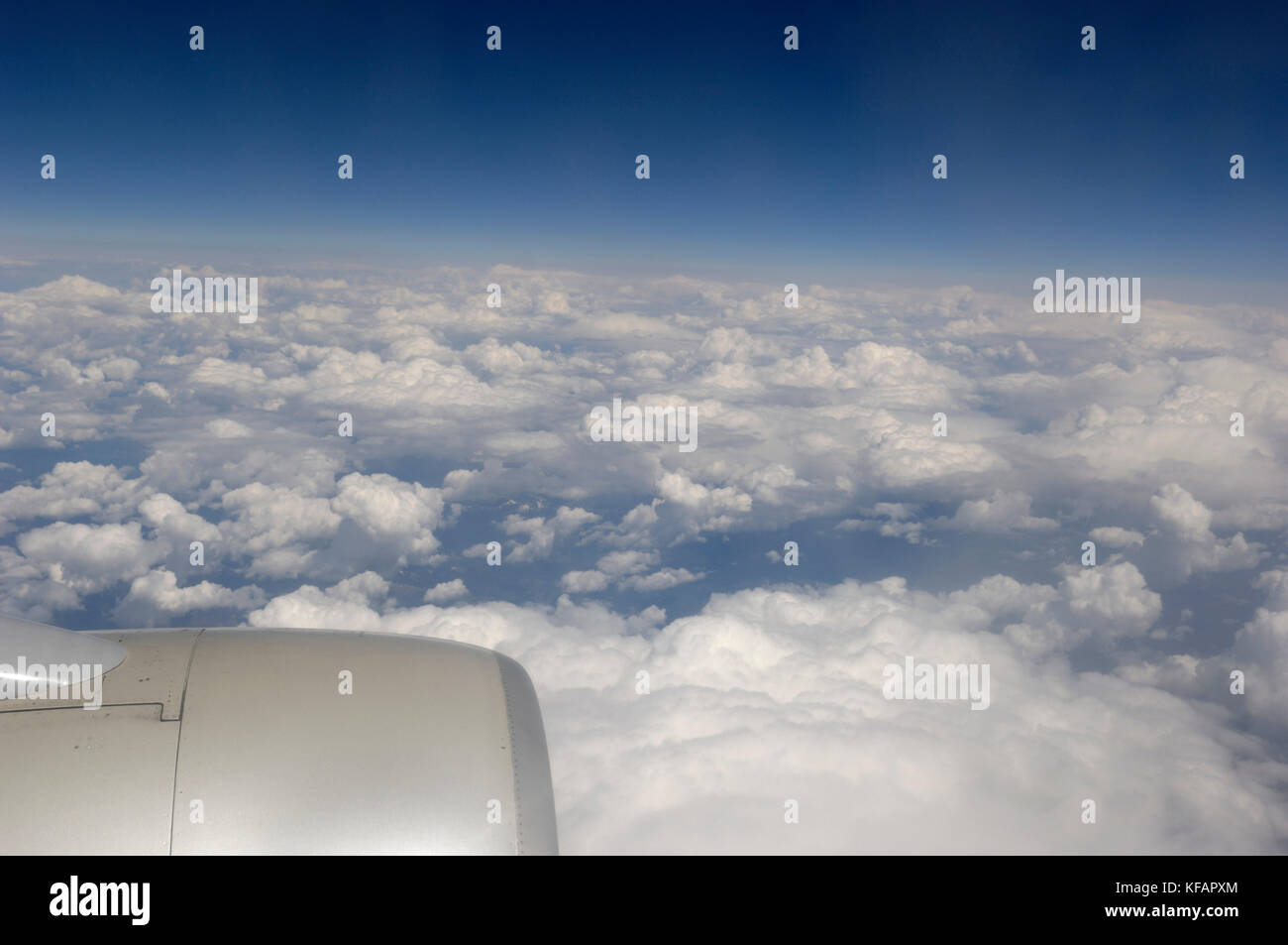 broken alto-cumulus clouds and a Pratt-&-Whitney PW2037 jet-engine of a Northwest Airlines Boeing 757-200 enroute SEA-MSP flight-number NW160 Stock Photo
