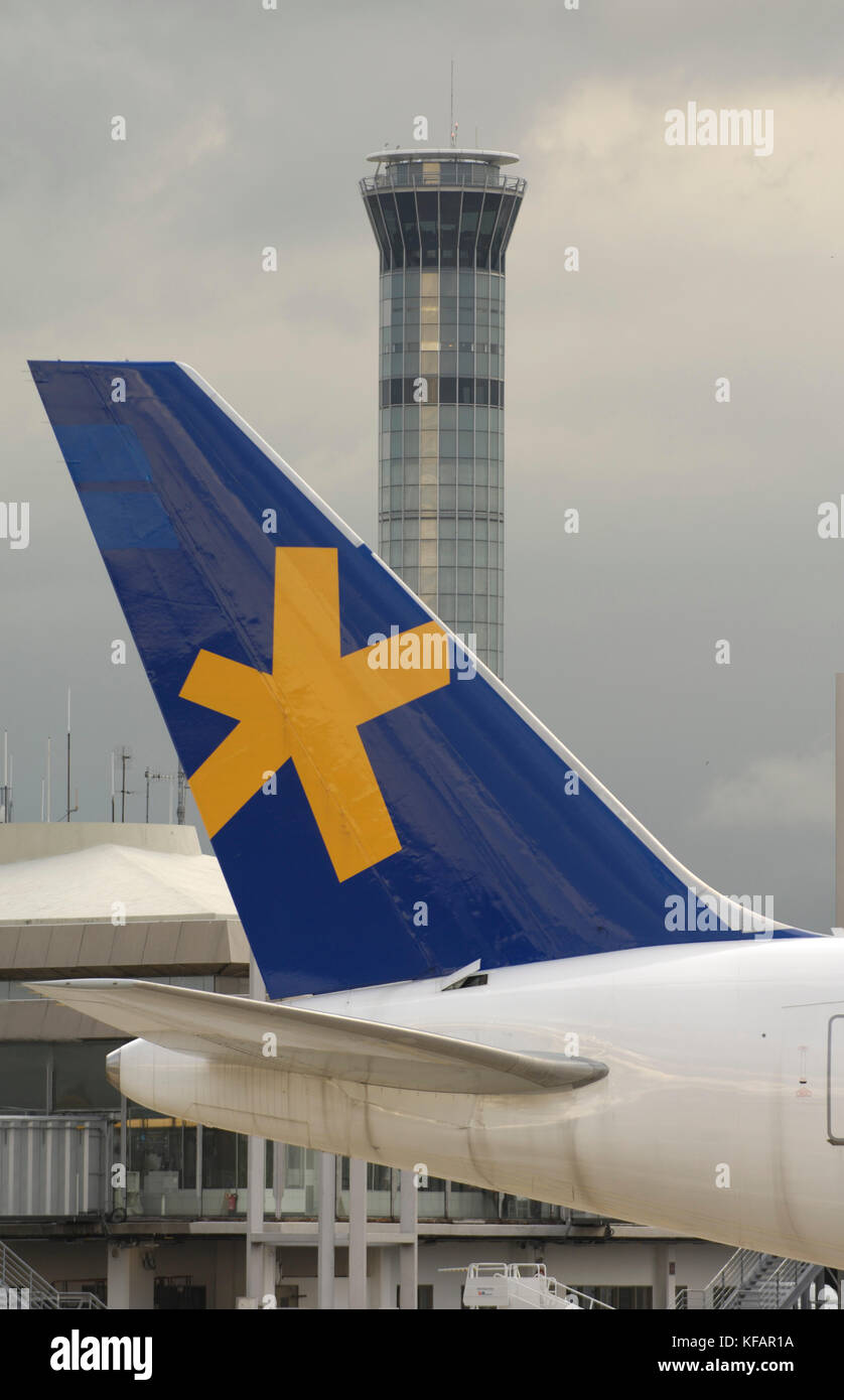 tail of the Gabon Airlines, Gabon Boeing 767-219ER with air traffic control-tower behind Stock Photo
