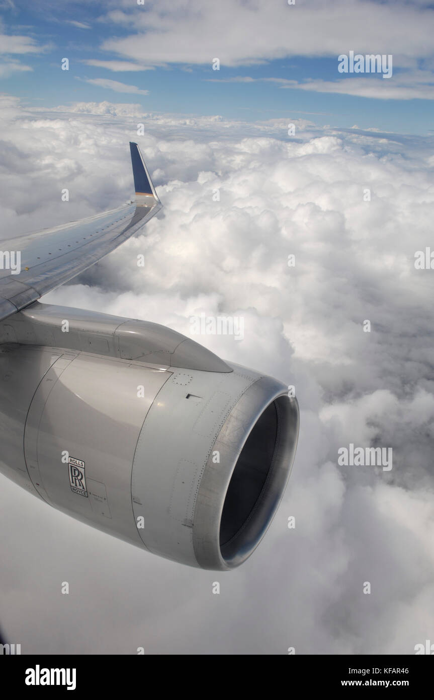 a Rolls-Royce RB-211-535 jet engine, wing and winglet flying near clouds on a Continental Airlines Boeing 757-224 flying enroute BRS-EWR as flight CO7 Stock Photo