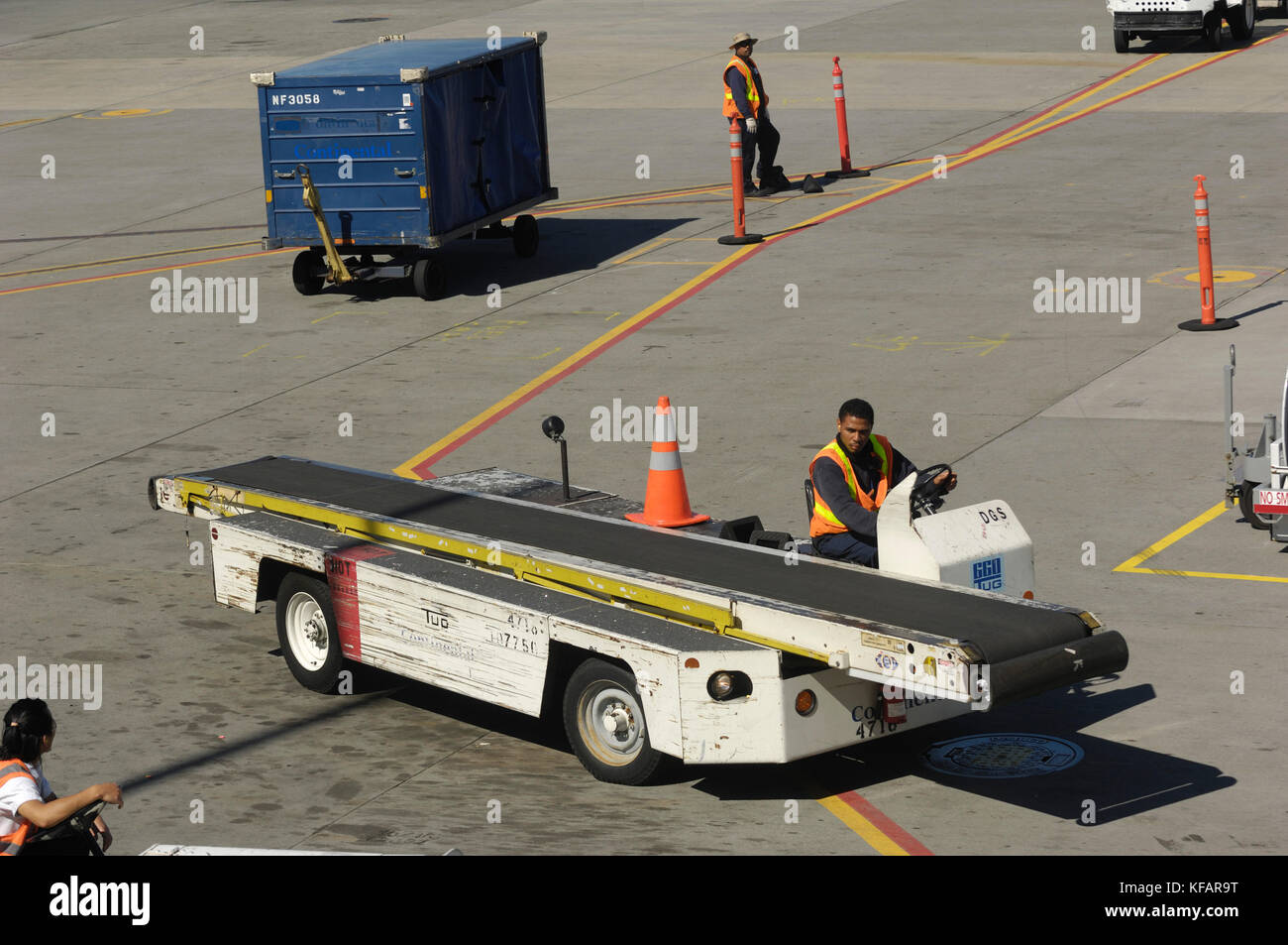 a baggage conveyor-belt truck on the apron Stock Photo - Alamy