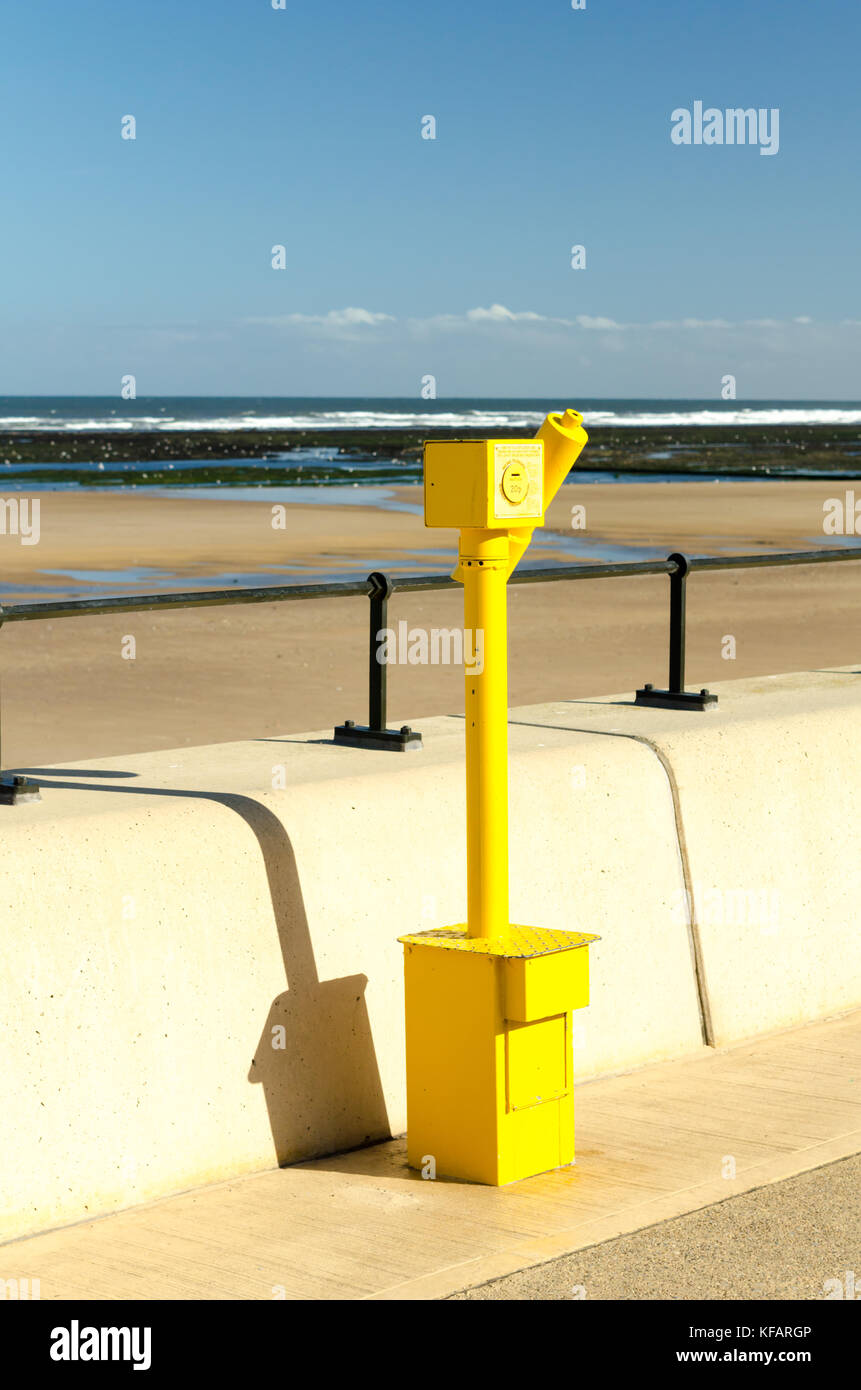 A Yellow Tourist Telescope ( Coin Operated Telescope) situated at Redcar Esplanade, Redcar Stock Photo