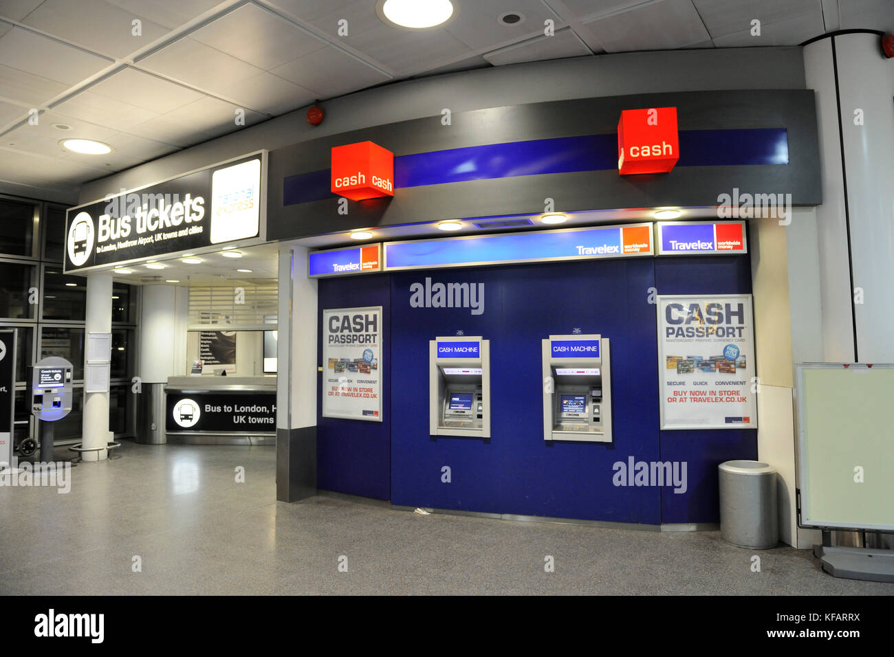 Travelex currency exchange cash-machines in the arrivals aea at Gatwick North-Terminal and a bus ticket-office Stock Photo